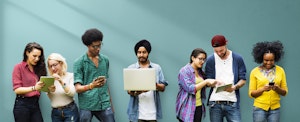 A diverse group of young people against a turquoise backdrop