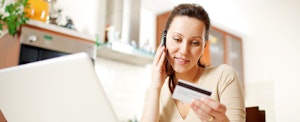 Woman shops online while on the phone