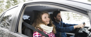Young couple sitting in a car