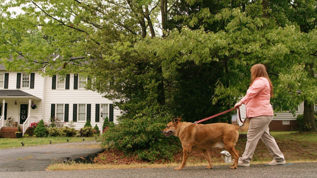 member-stories-donna-3 Donna walks her dog in the neighborhood
