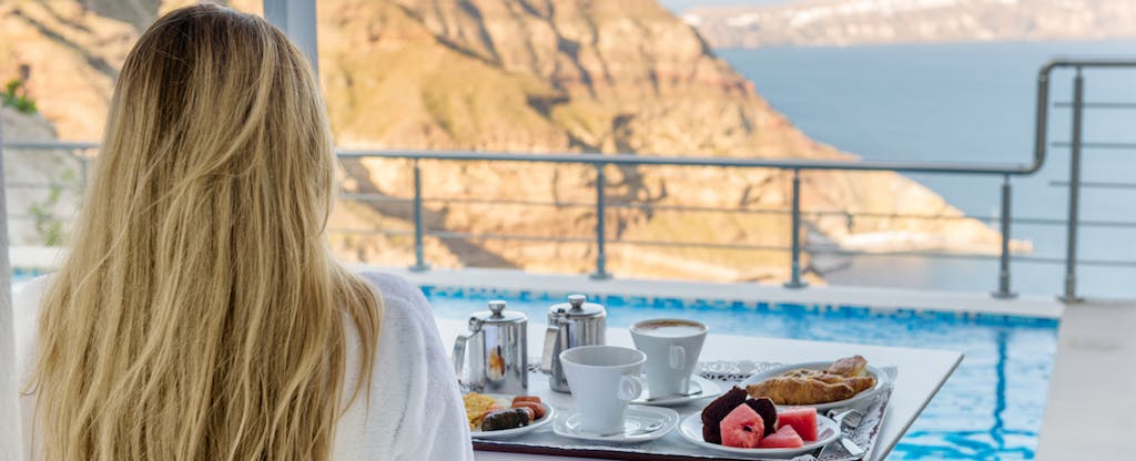 Woman enjoying breakfast that earns her Hilton Honors points