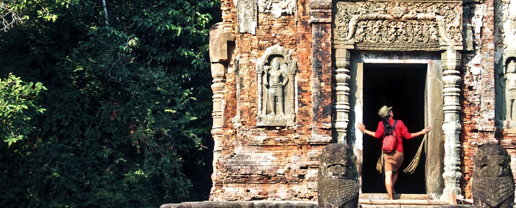Woman with backpack exploring a Cambodian temple