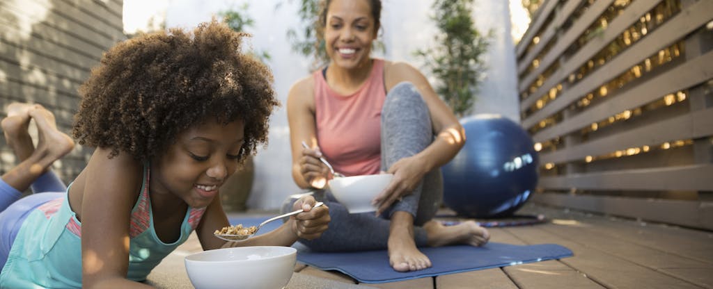 Mother and daughter discuss FICO Score 8 while eating cereal