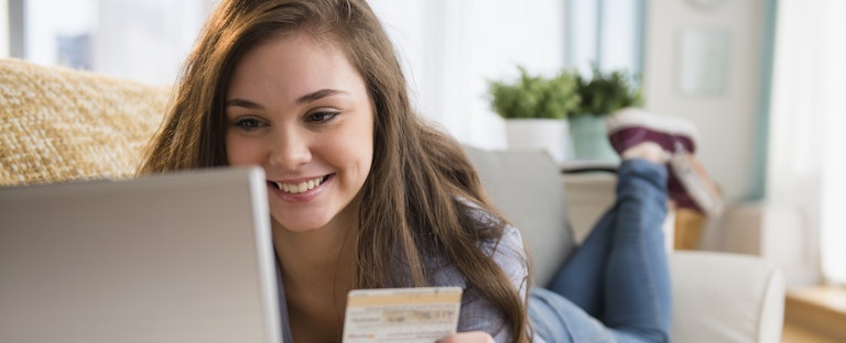 Woman shopping on sofa