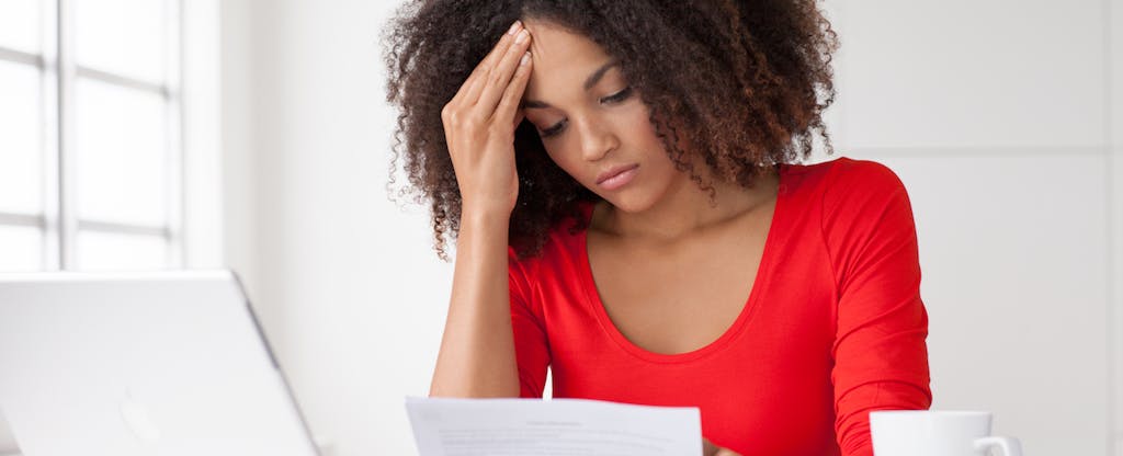 A concerned woman thinks about stress spending habits