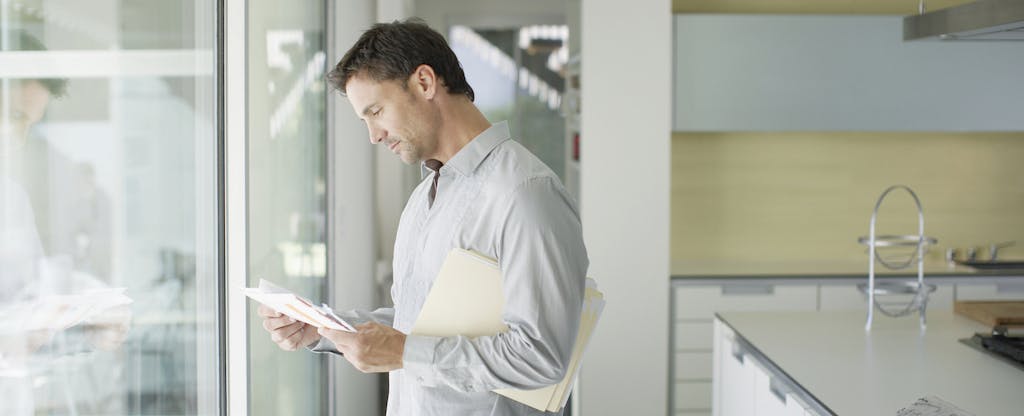 Man sorting mail and wondering how to remove late payments