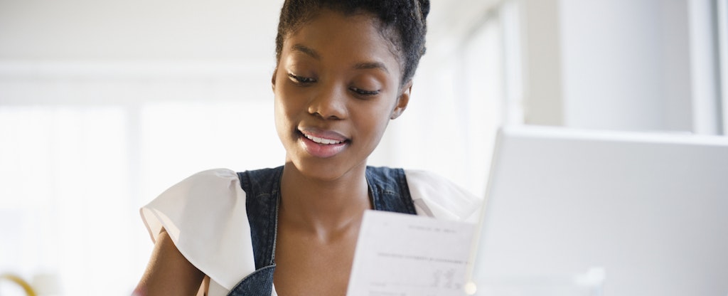 Woman learning how to refinance a personal loan