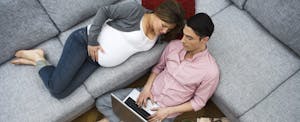 A pregnant couple reviewing how tax plan changes could affect their 2018 federal income tax return.