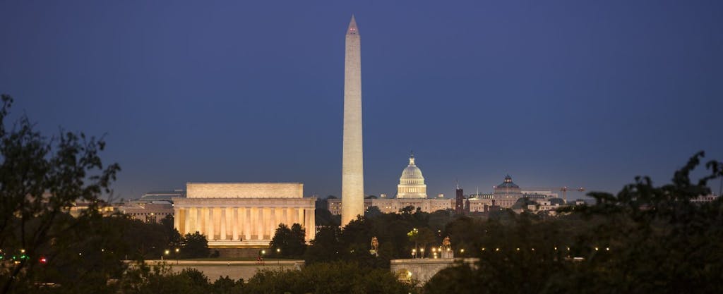Three famous District of Columbia landmarks - the Lincoln Memorial, Washington Monument and Capitol building - at twilight.