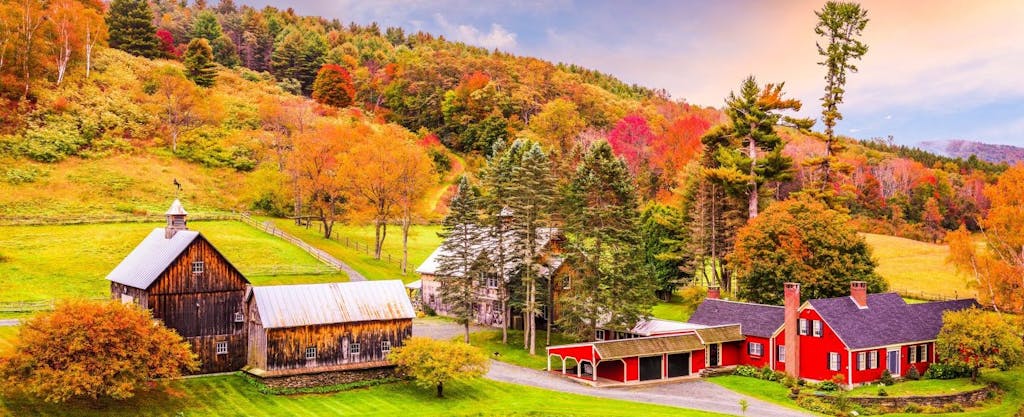 Early autumn colors adorn a rural farm in scenic Vermont.