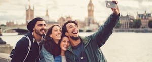 Group of friends taking selfie in London