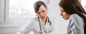 Doctor speaking with her patient