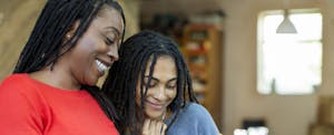 Two women looking at a phone together