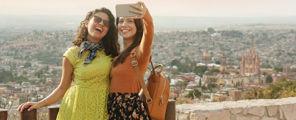 Two friends traveling abroad taking a selfie