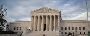 US Supreme Court building against cloudy sky