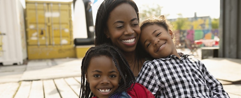 Woman with her children excited about her Kashable loans approval