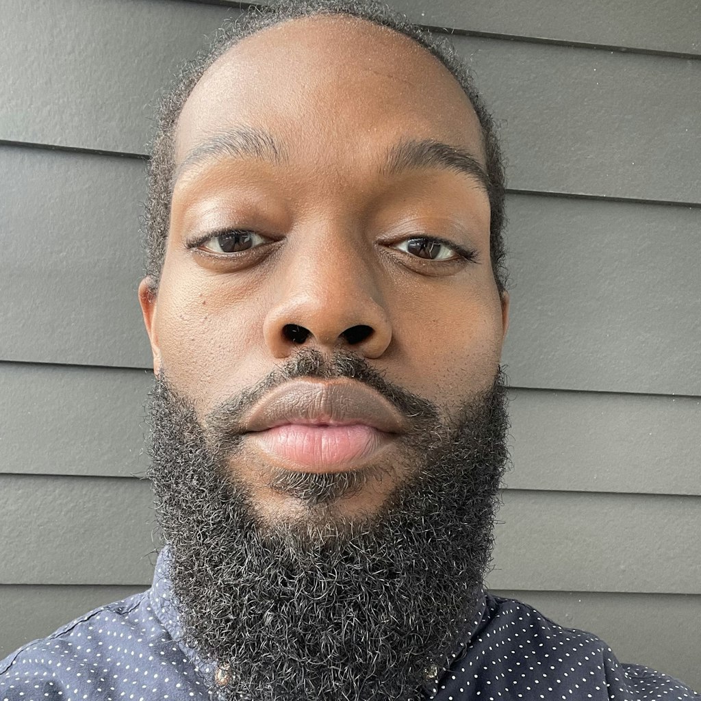 Headshot of Charles McArthur-Johnson, Content Coordinator at Intuit Credit Karma