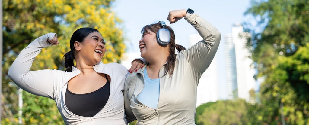 how-long-does-it-take-to-build-credit_2247293007 Cheerful smiling friends, young Asian women, in sportswear happy while walking after exercise.